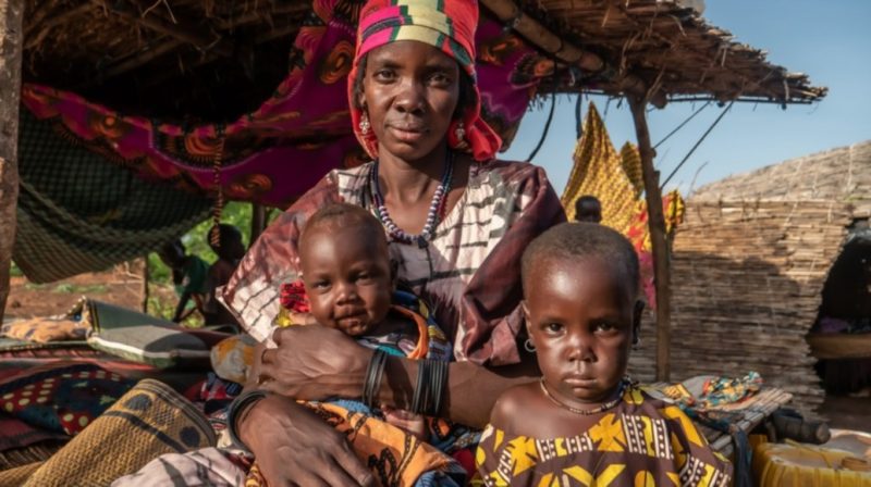 Puebla* with her two children at an unofficial IDP site in Burkina Faso where community leaders say food shortages are a constant worry. Photo: Henry Wilkins / Concern Worldwide